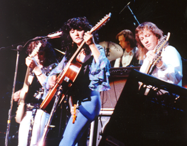 Citadel performing on stage with guitars